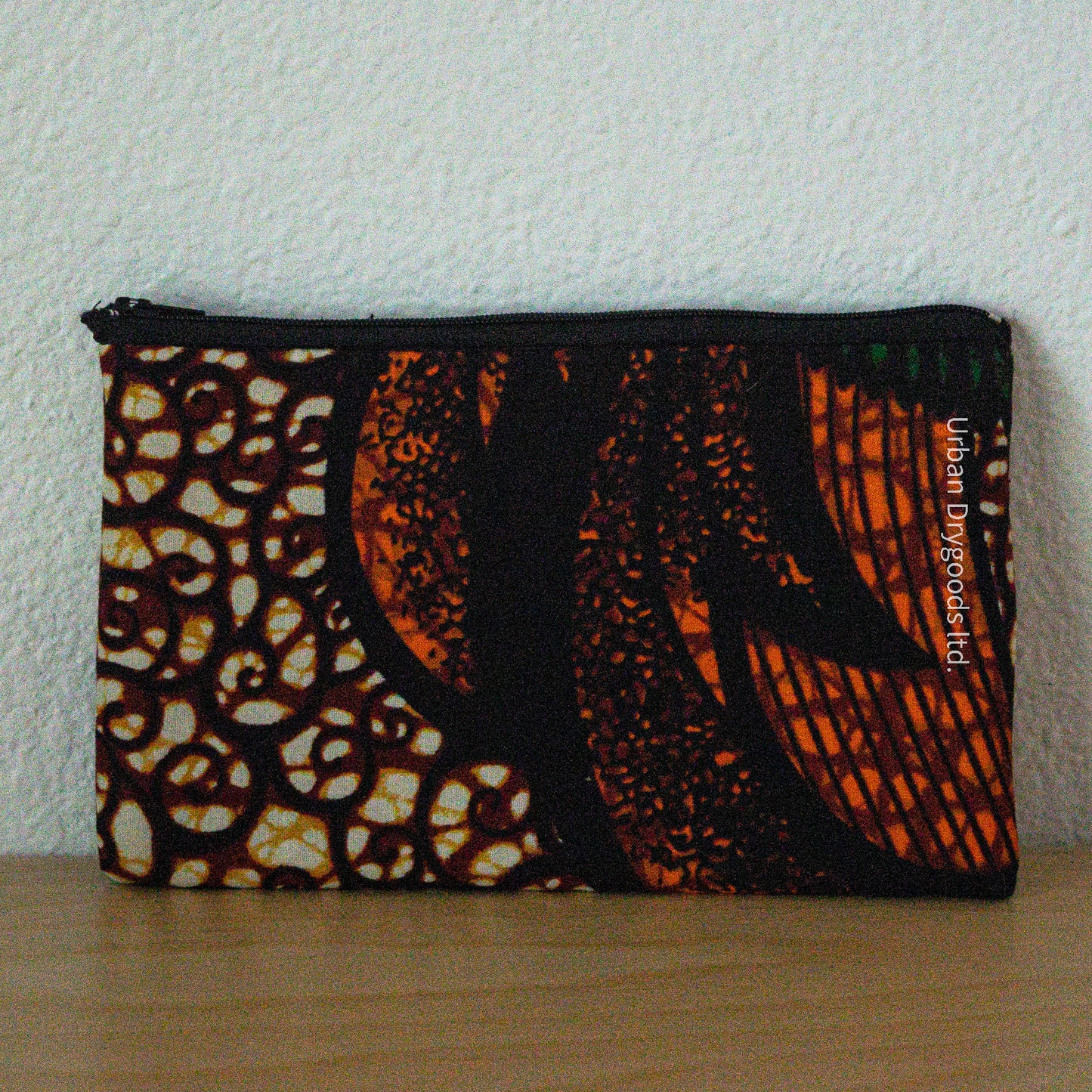 African, Handmade Padded Case for E-Readers, Jewelry, Etc. Orange, Brown, and Gold with Black Swirls