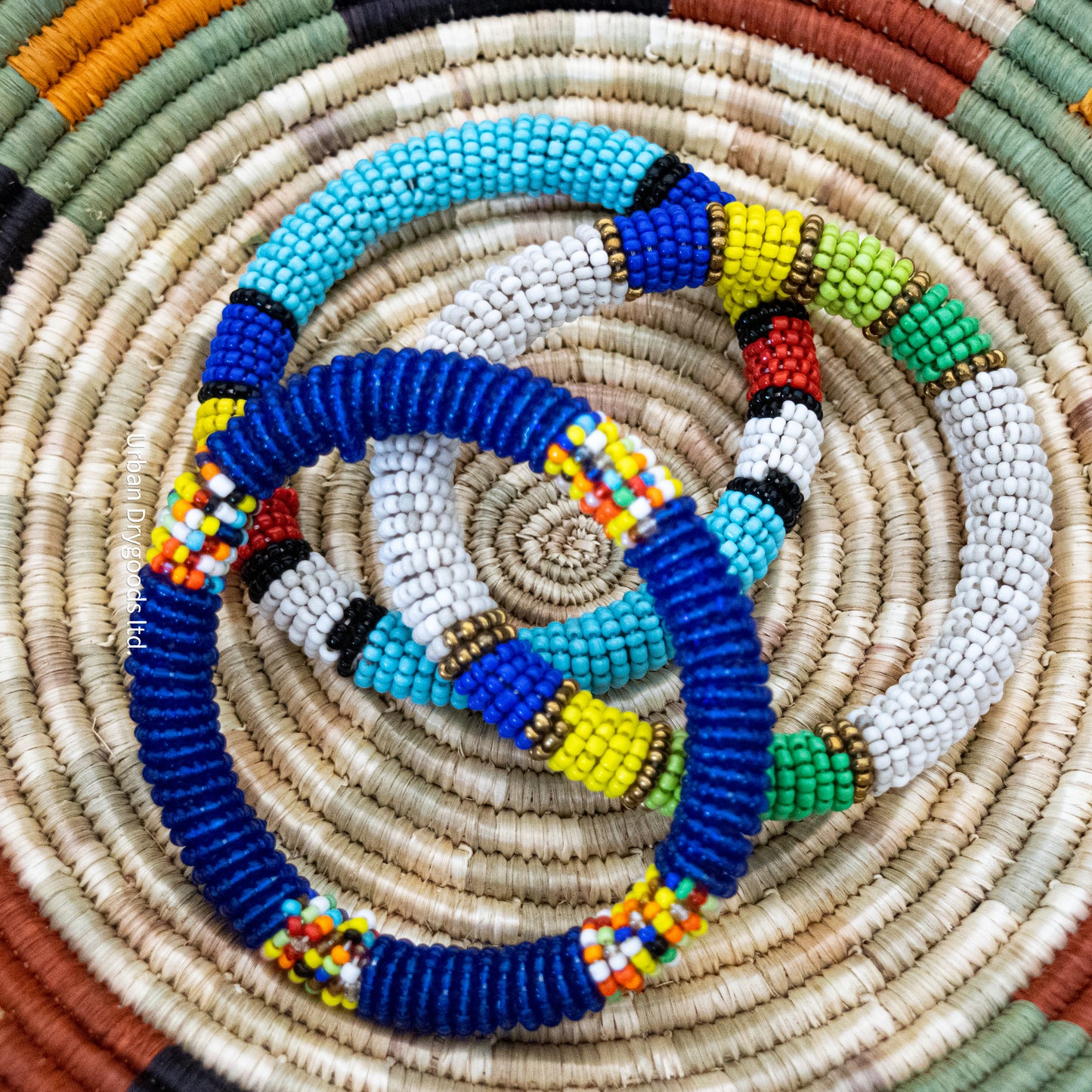 African Beaded Bangle Bracelet, White with Bronze, Light Green, Medium Green, Yellow, and Blue Accents