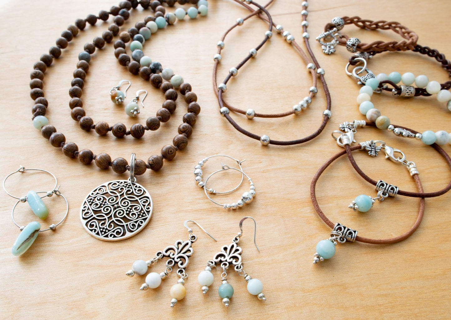 Beginnings, Natural Amazonite and Wooden Beaded Necklaces with a Silver Pendant