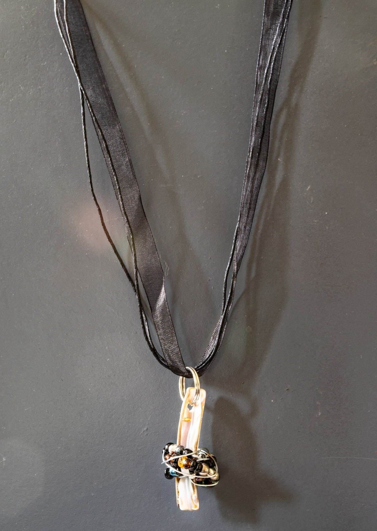 Wraps, Necklace with Shell Pendant Wrapped in Beads on Back Ribbon