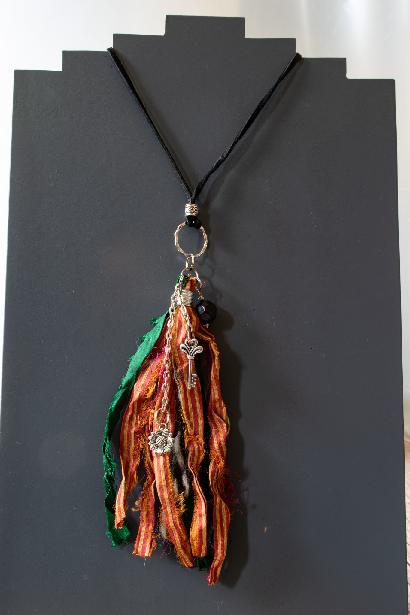 Silk Road 31'' Adjustable leather necklace with a silk tassel emerald red orange flower and key charm