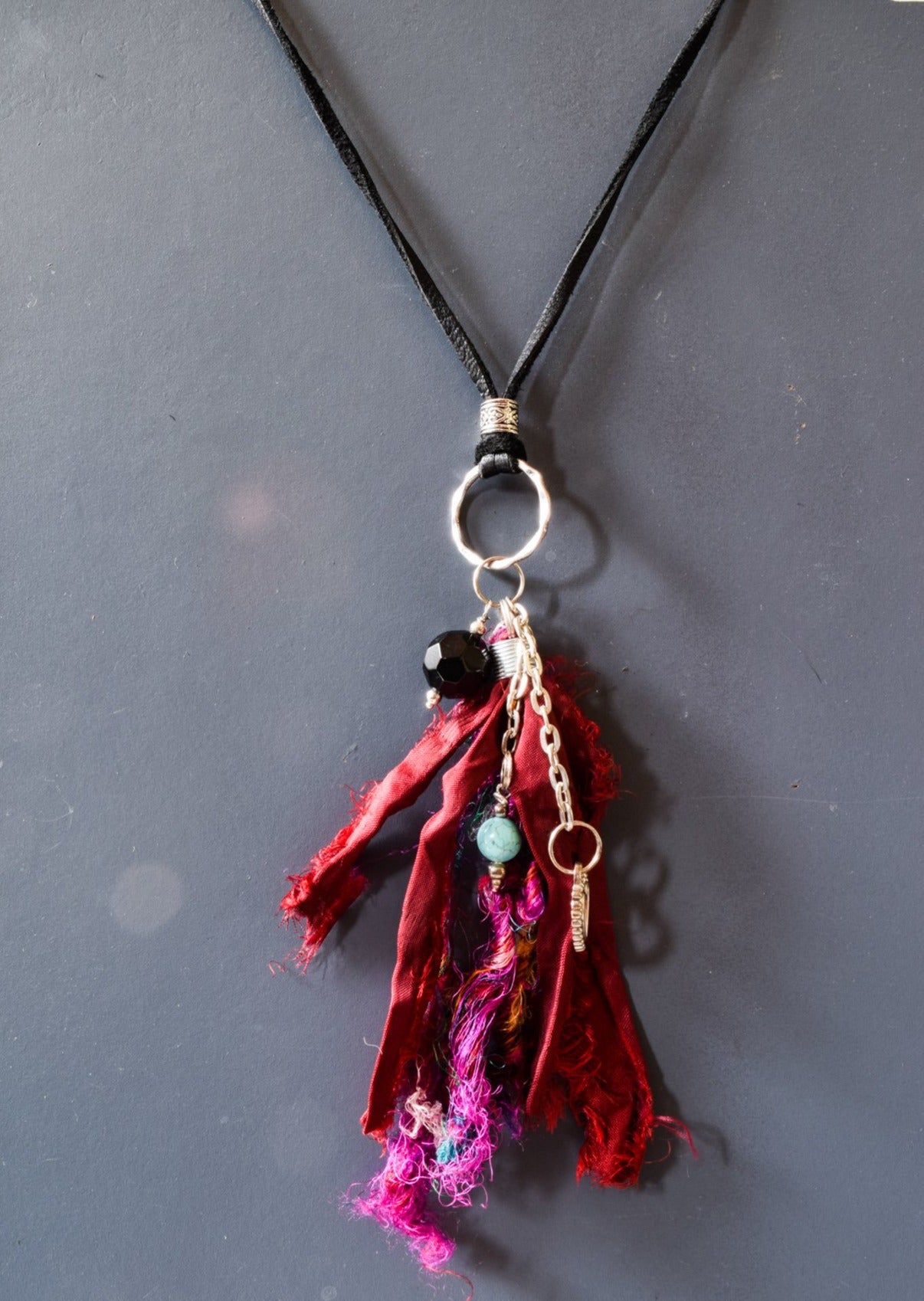 Silk Road, Adjustable Leather Necklace with a Fuchsia Silk Tassel, Amethyst, Silver Heart, and Turquoise Charms