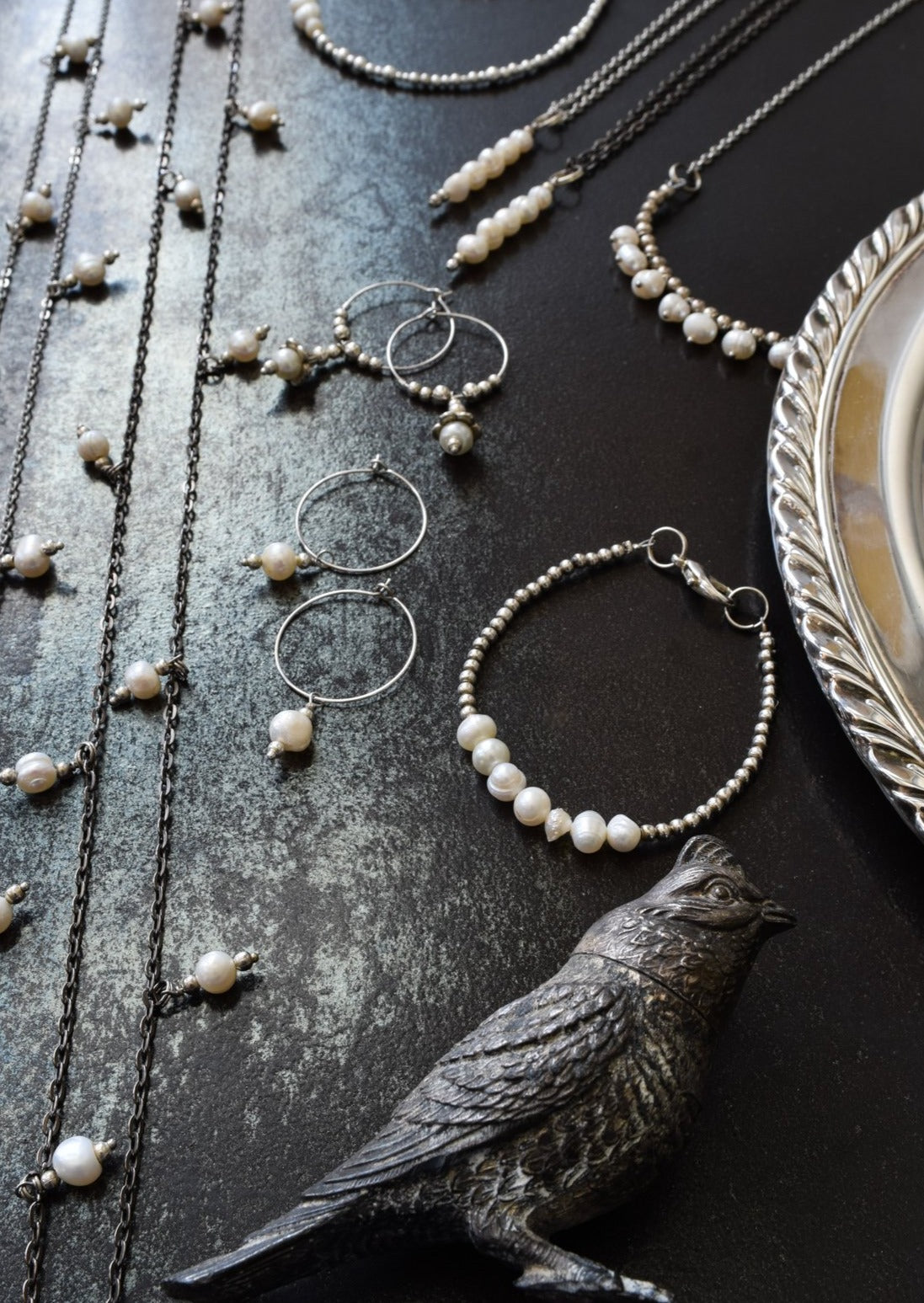 Expressions in Pearls Collection. pearl necklaces, hoop earrings , bracelet by urban dry goods ltd .