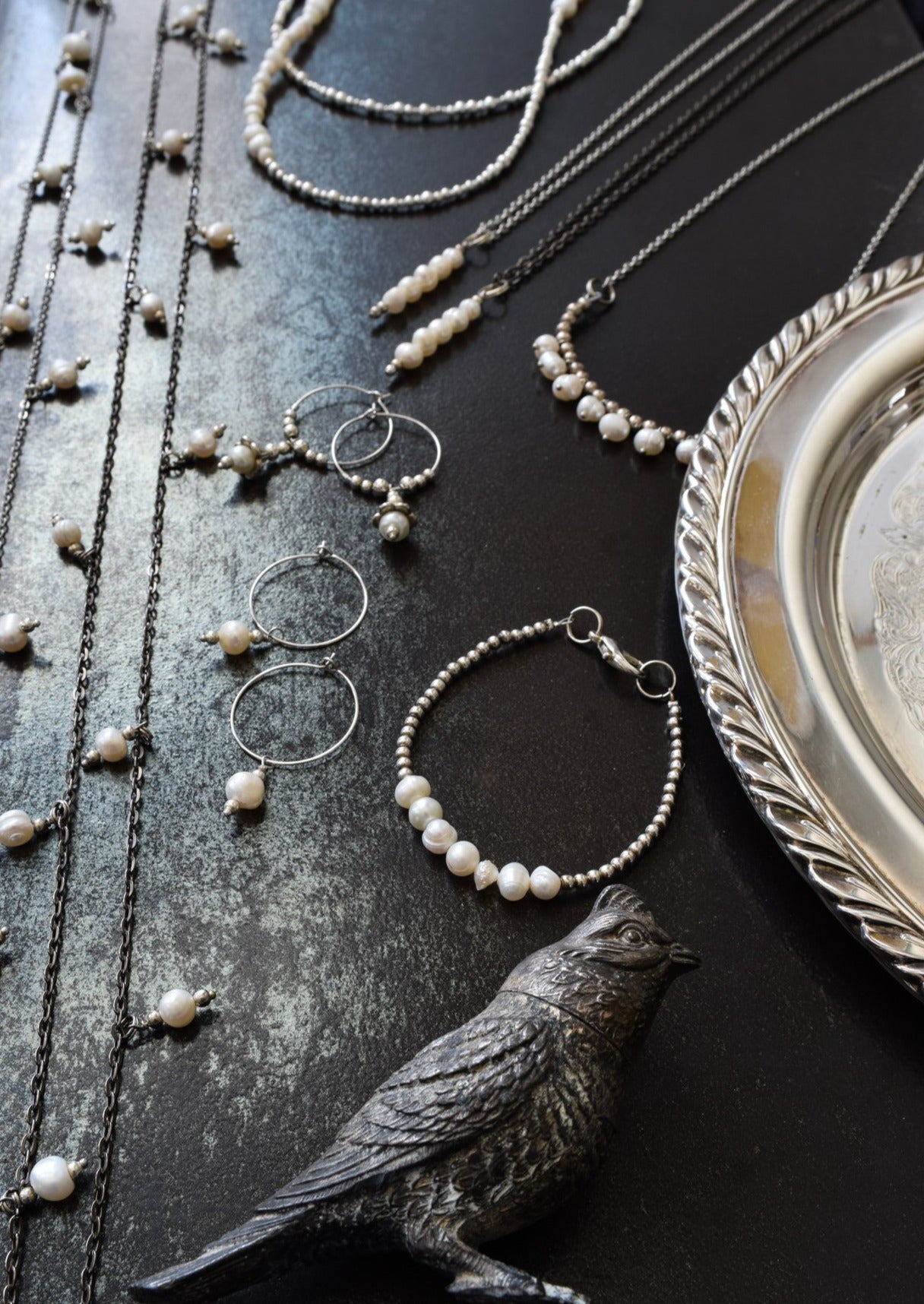 Expressions in Pearls collection of earrings necklaces, and bracelet found in our Modern Vintage Collection .