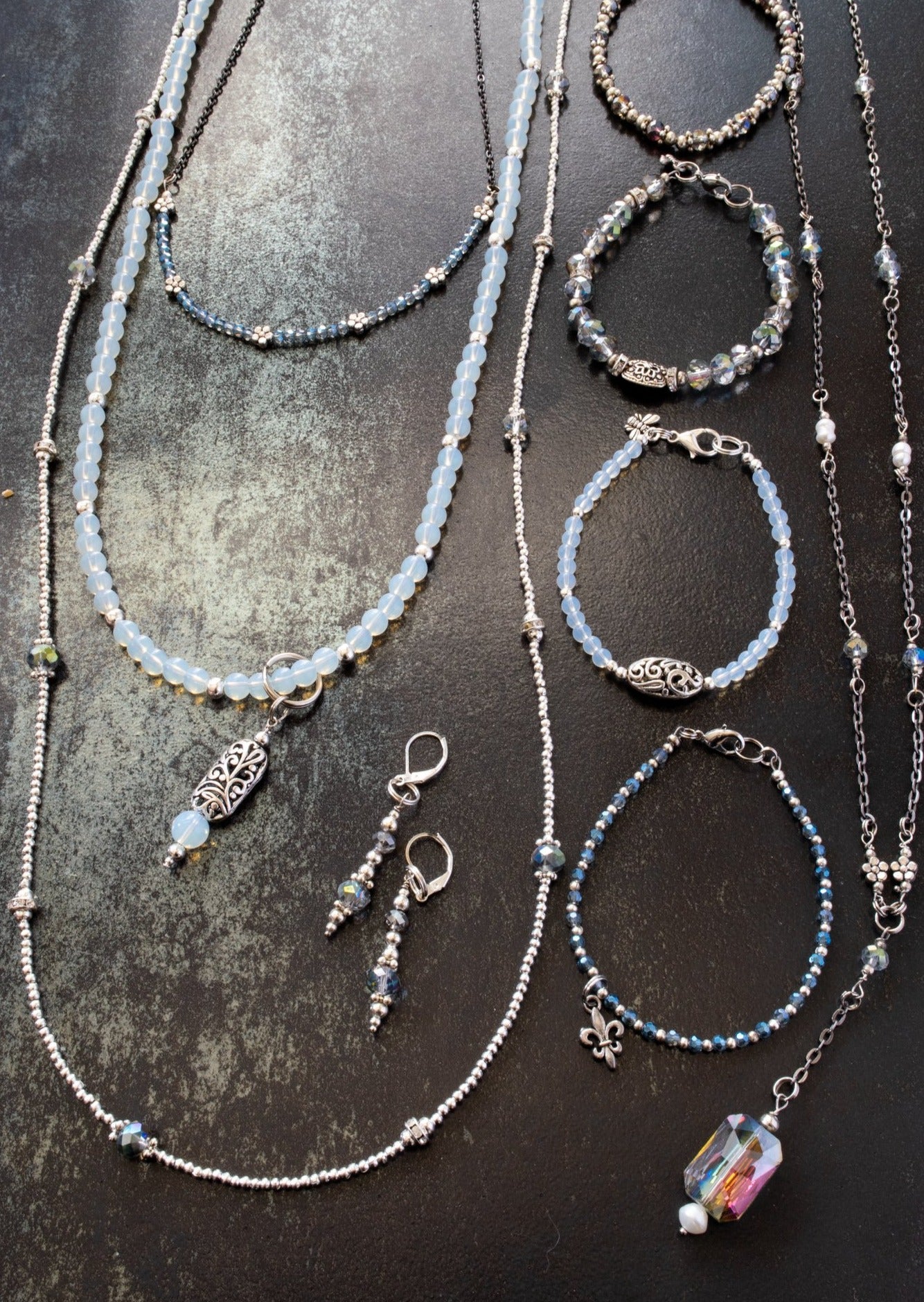 Expressions in Blue, Bracelet with Electro-Plated Aquamarine Crystals, Silver Beads, and an Antiqued Silver Fleur-De-Lei Charm