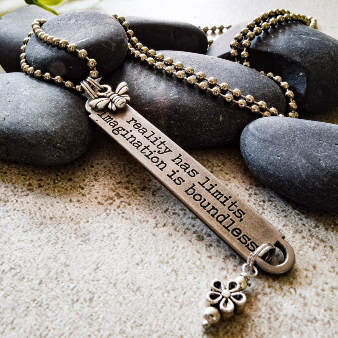 Words to Inspire, Ball Chain Necklace with Engraved Metal Tag "Reality has limits"