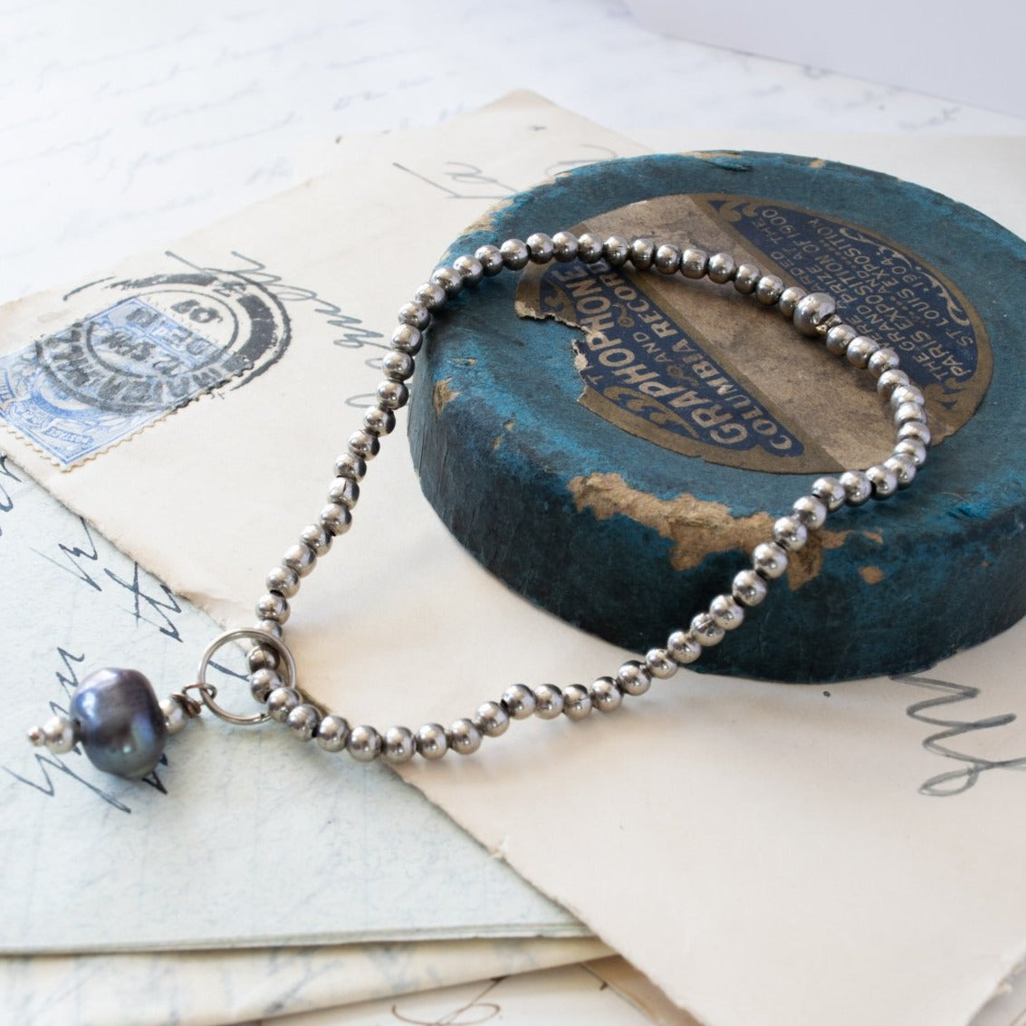 Stackables Bracelet with Antiqued Silver Beads with a Prussian Blue Pearl Charm