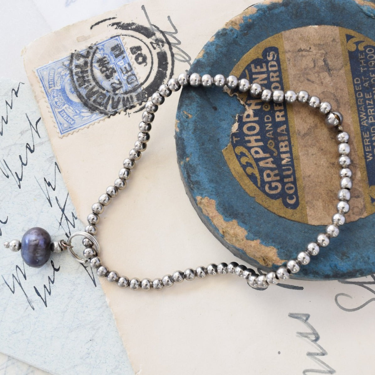 Stackables Bracelet with Antiqued Silver Beads with a Prussian Blue Pearl Charm