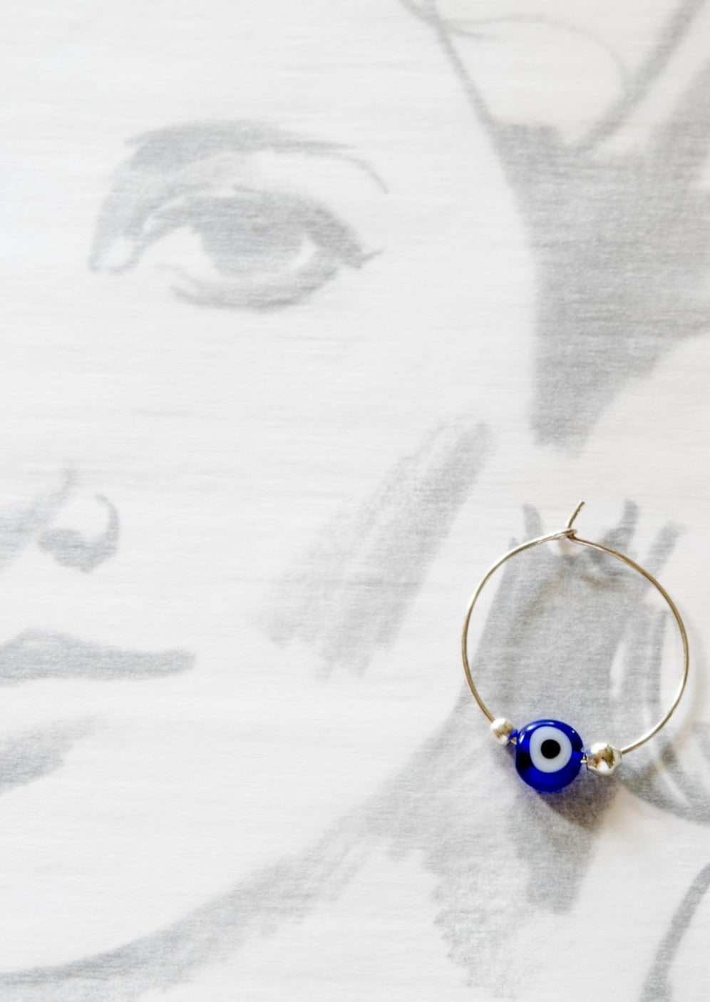 Little Treats, Silver Hoop Earrings with Blue Glass Evil Eye