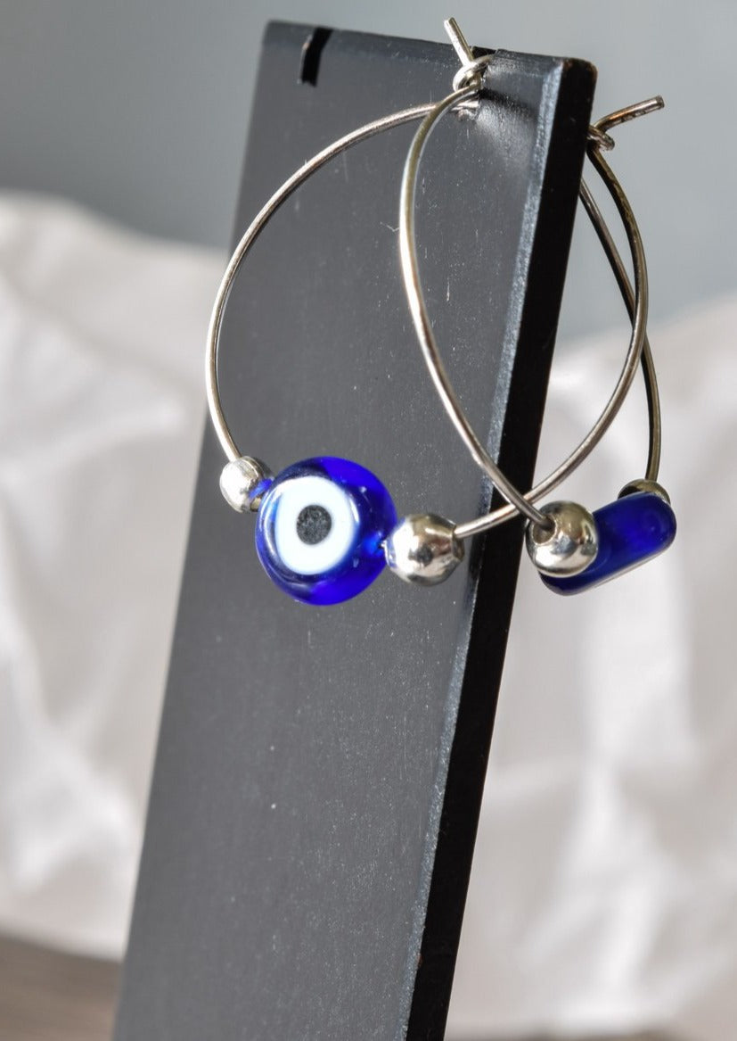 Little Treats, Silver Hoop Earrings with Blue Glass Evil Eye