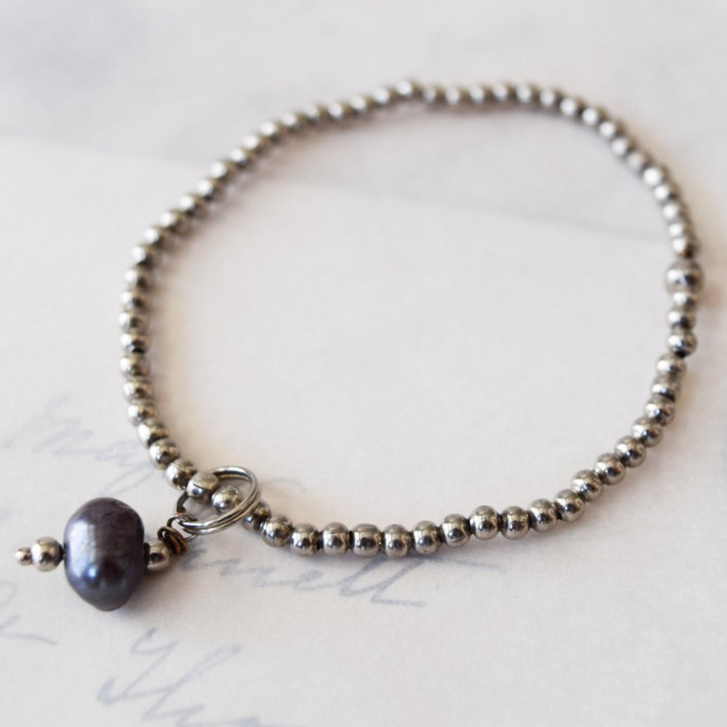 Stackables Bracelet with Antiqued Silver Beads with a Prussian Blue Pearl Charm