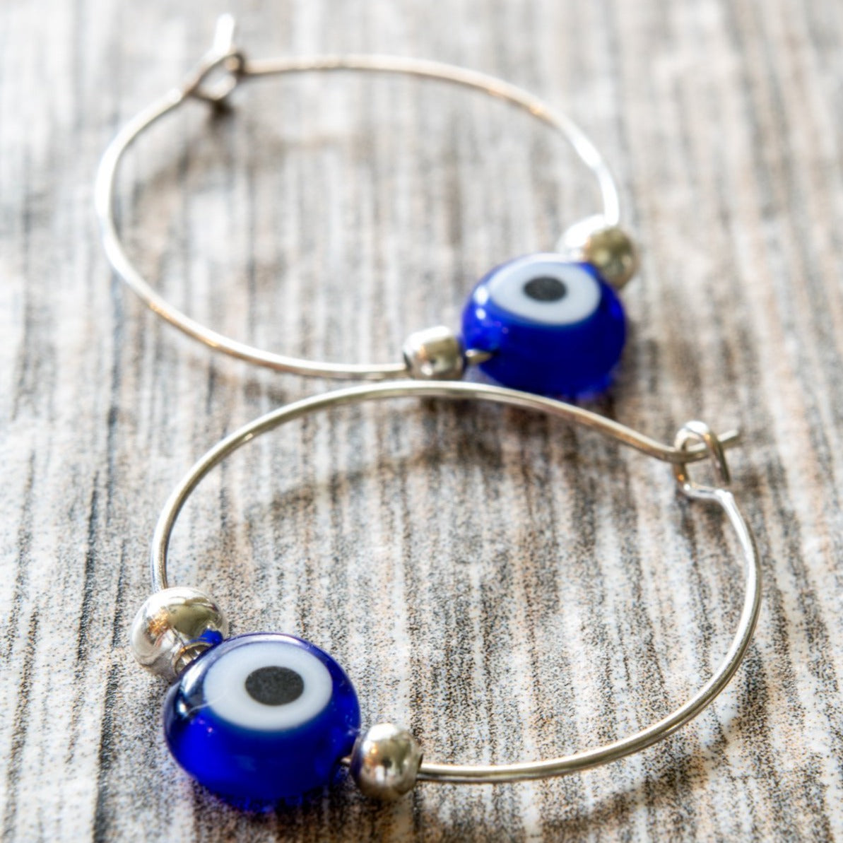 Little Treats, Silver Hoop Earrings with Blue Glass Evil Eye