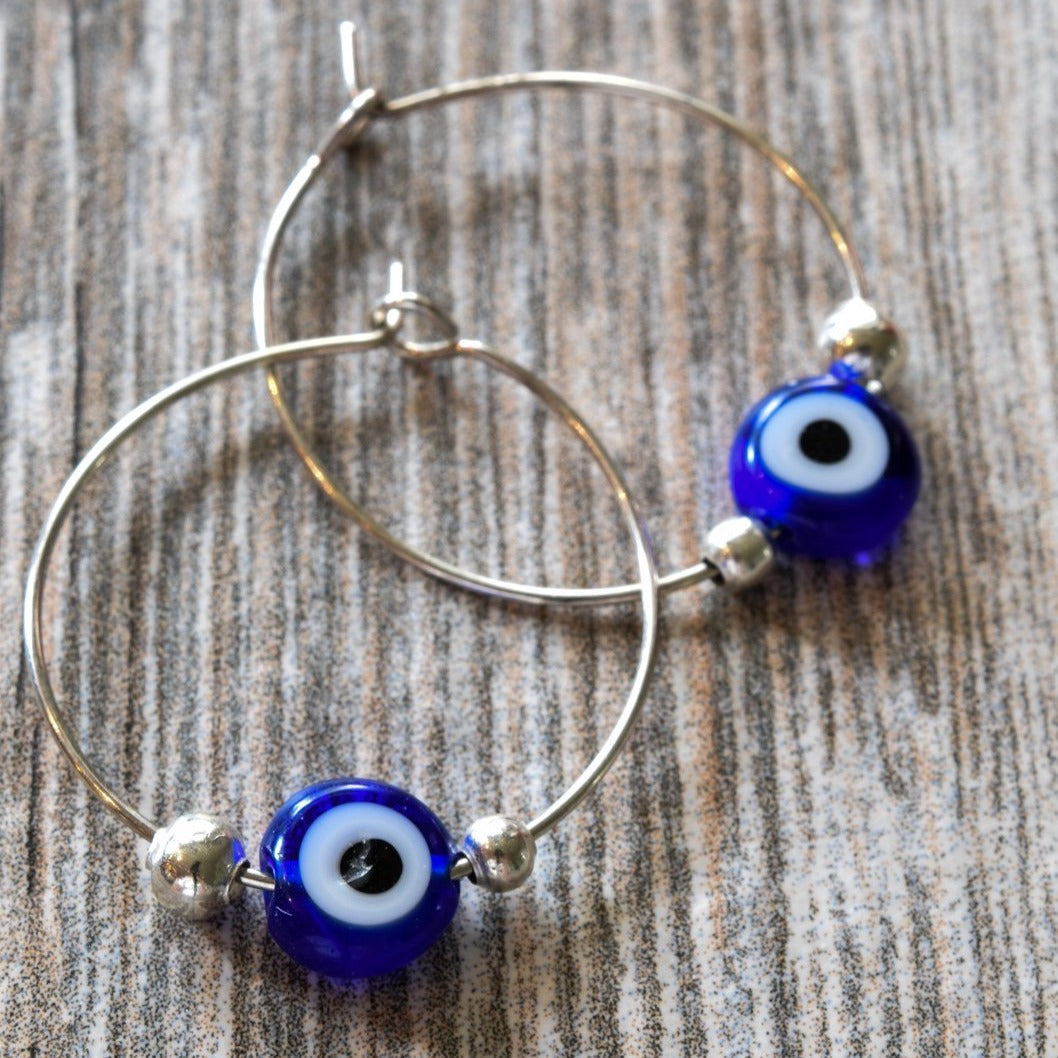 Little Treats, Silver Hoop Earrings with Blue Glass Evil Eye