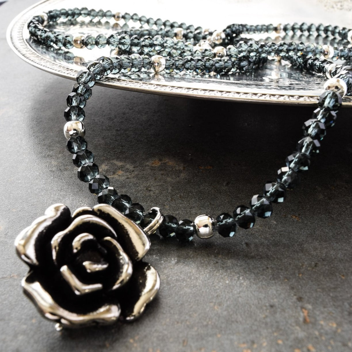 Expressions in Jewels, Necklace with Faceted Prussian Blue Crystals and a Silver Rose Pendant