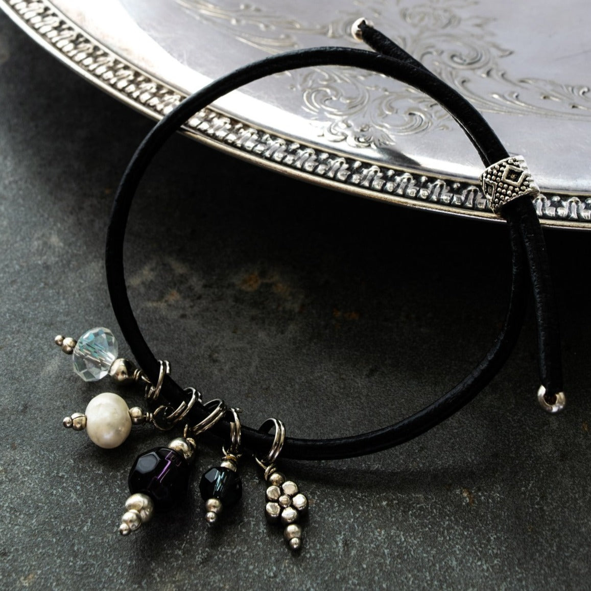 Expressions In Jewels, Adjustable Black Leather Bracelet, with Assorted Crystals and a Fresh Water Pearl