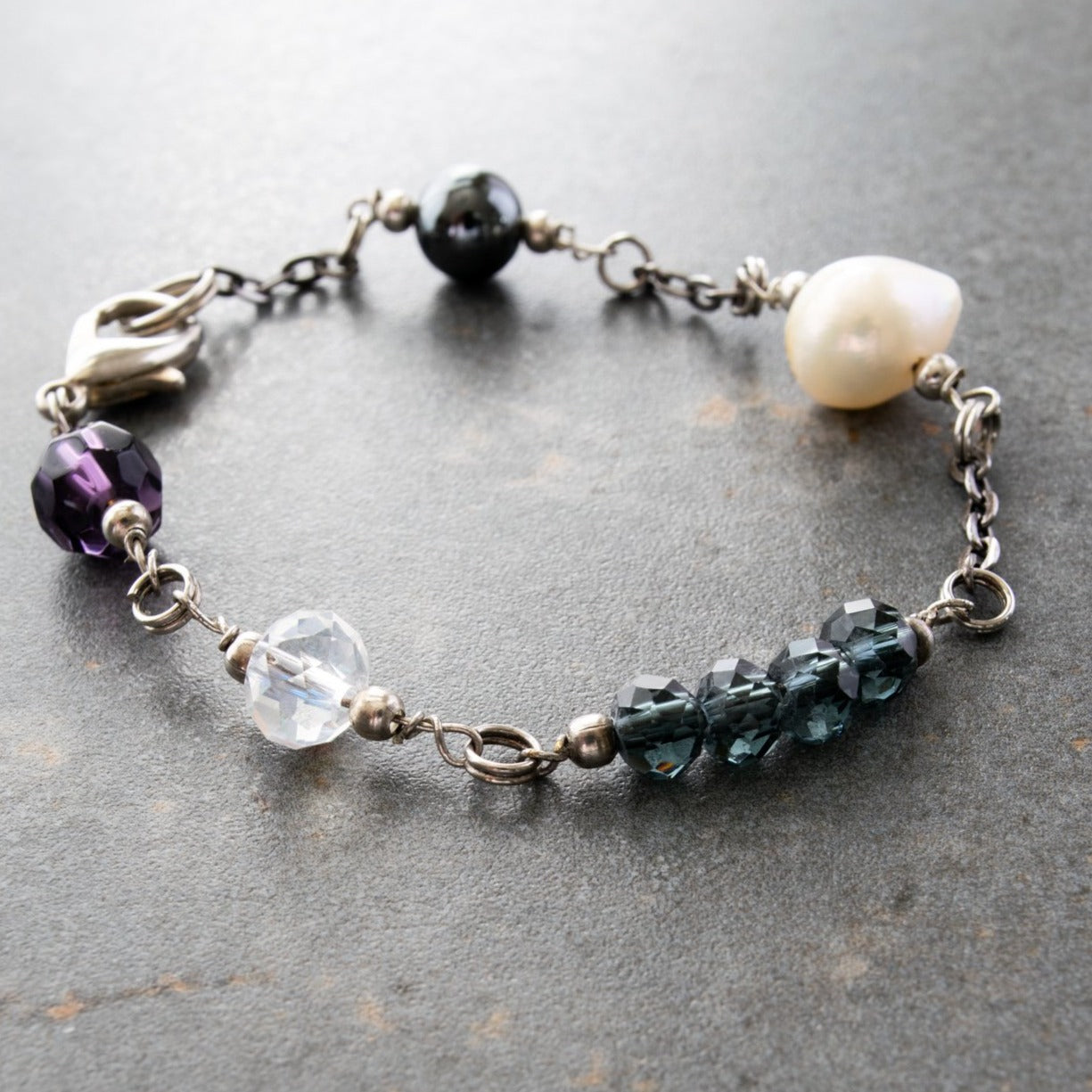 Expressions in Jewels, Bracelet with Gunmetal Chain and links of Faceted Persian Blue, Electroplated Crystals, Hematite, and Fresh-Water Pearls