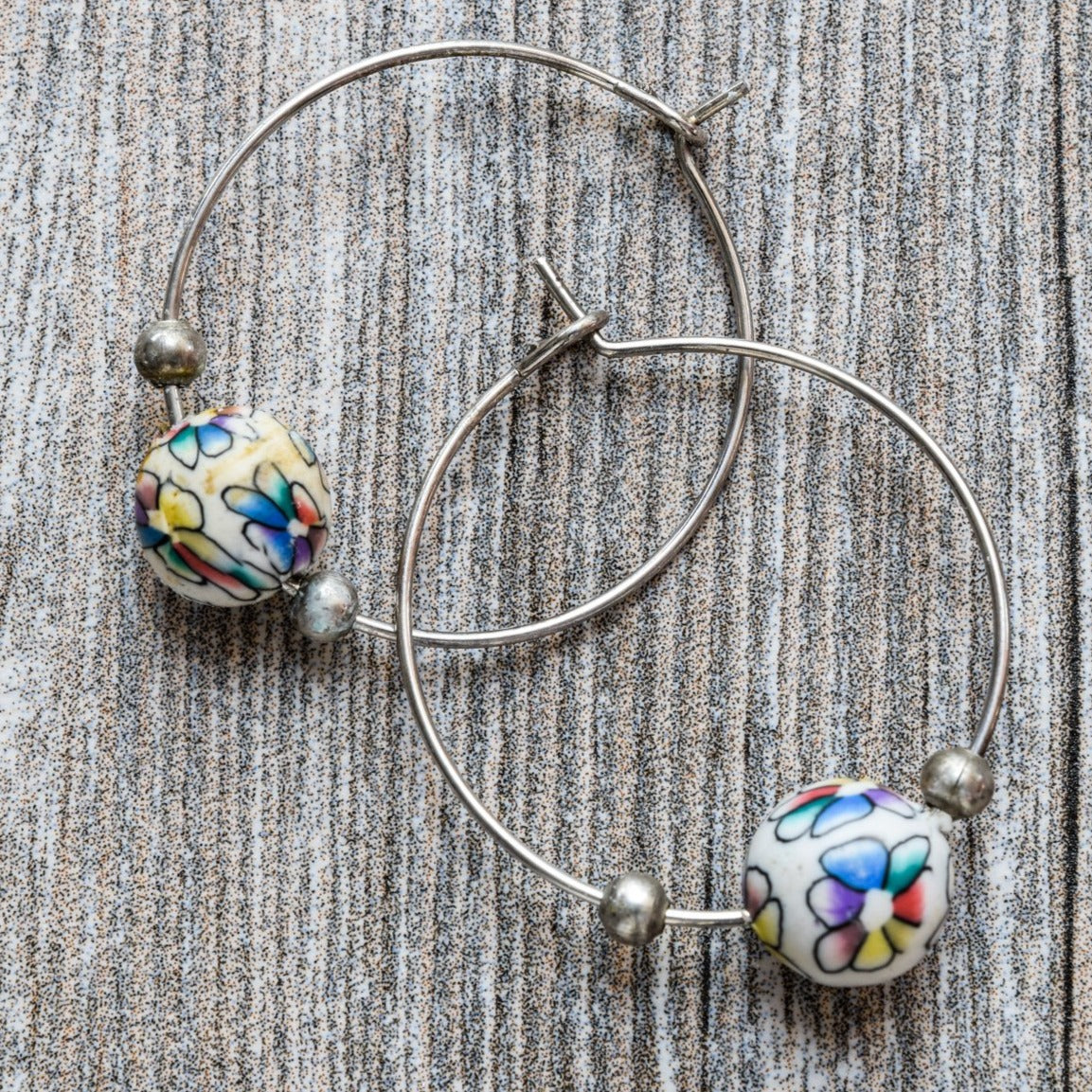 Little Treats, Flowers Silver Hoop Earrings with Little Colored Painted Flowers on White Polymer Clay