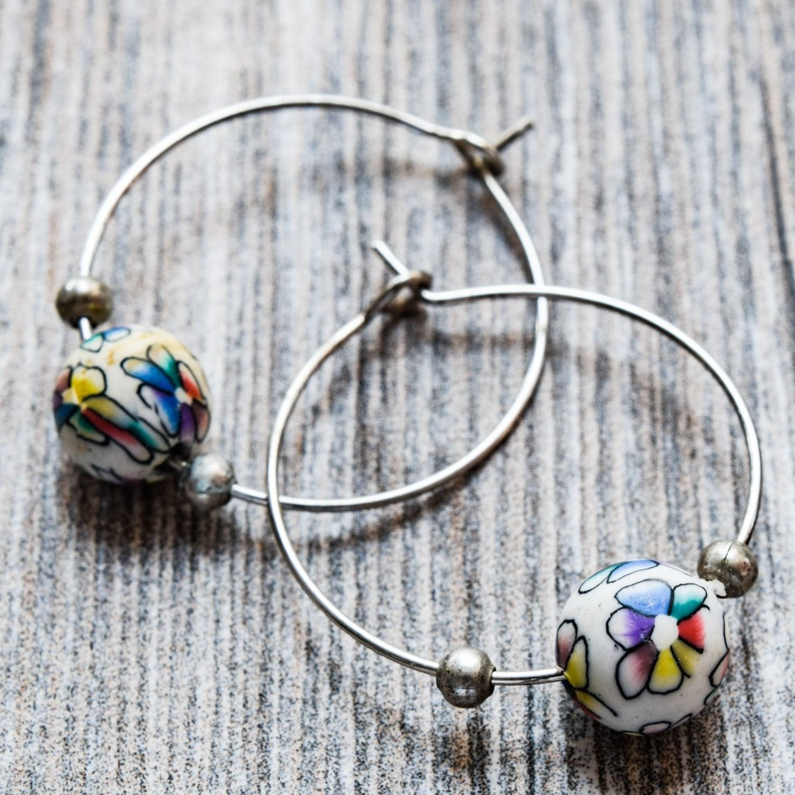 Little Treats, Flowers Silver Hoop Earrings with Little Colored Painted Flowers on White Polymer Clay