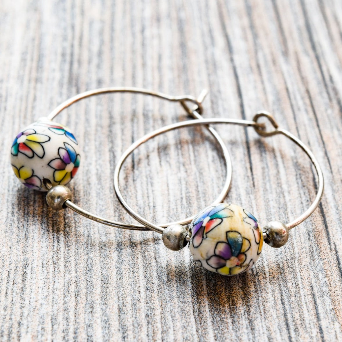 Little Treats, Flowers Silver Hoop Earrings with Little Colored Painted Flowers on White Polymer Clay