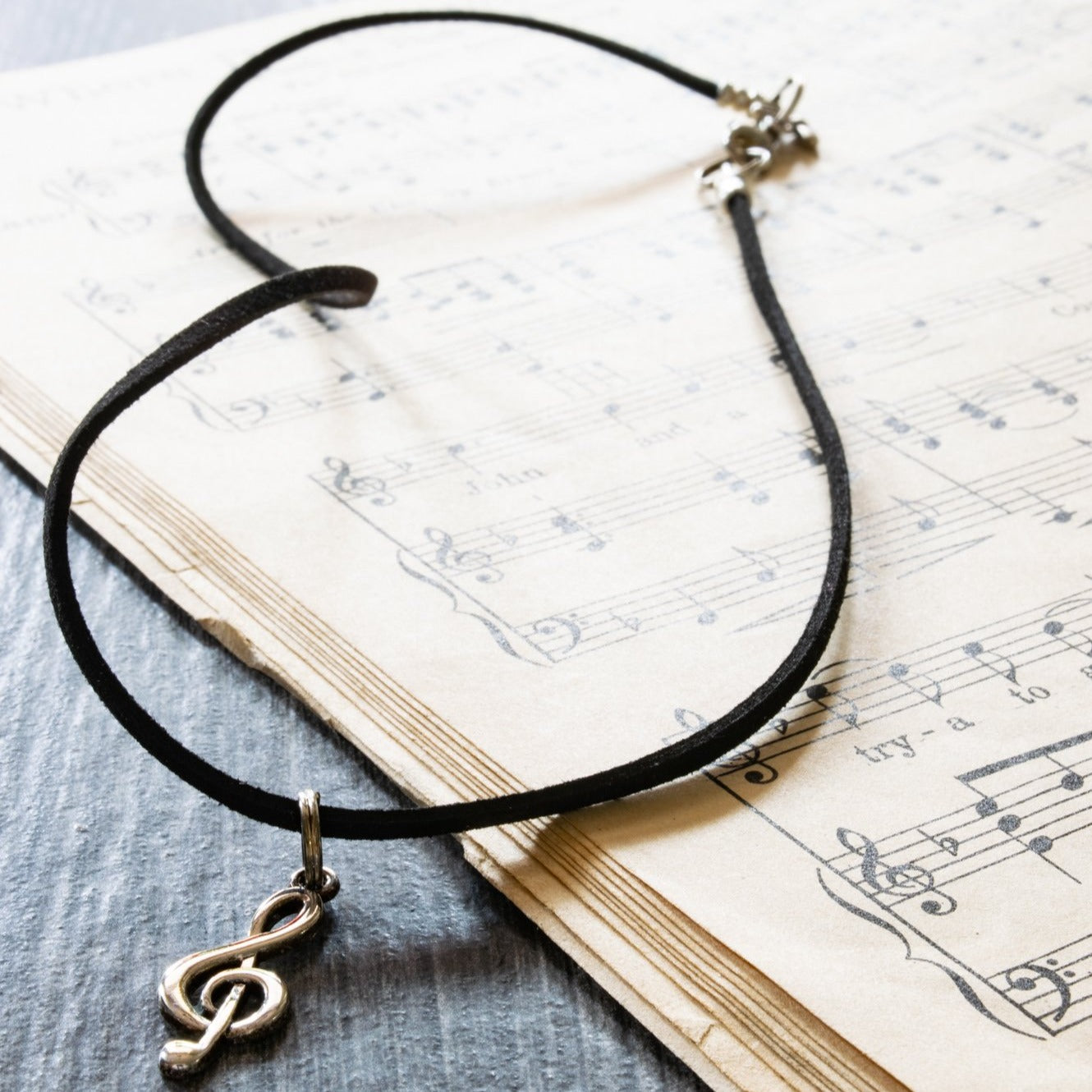 Little Treats, Faux Leather Cord Necklace with a Silver Treble Clef Pendant