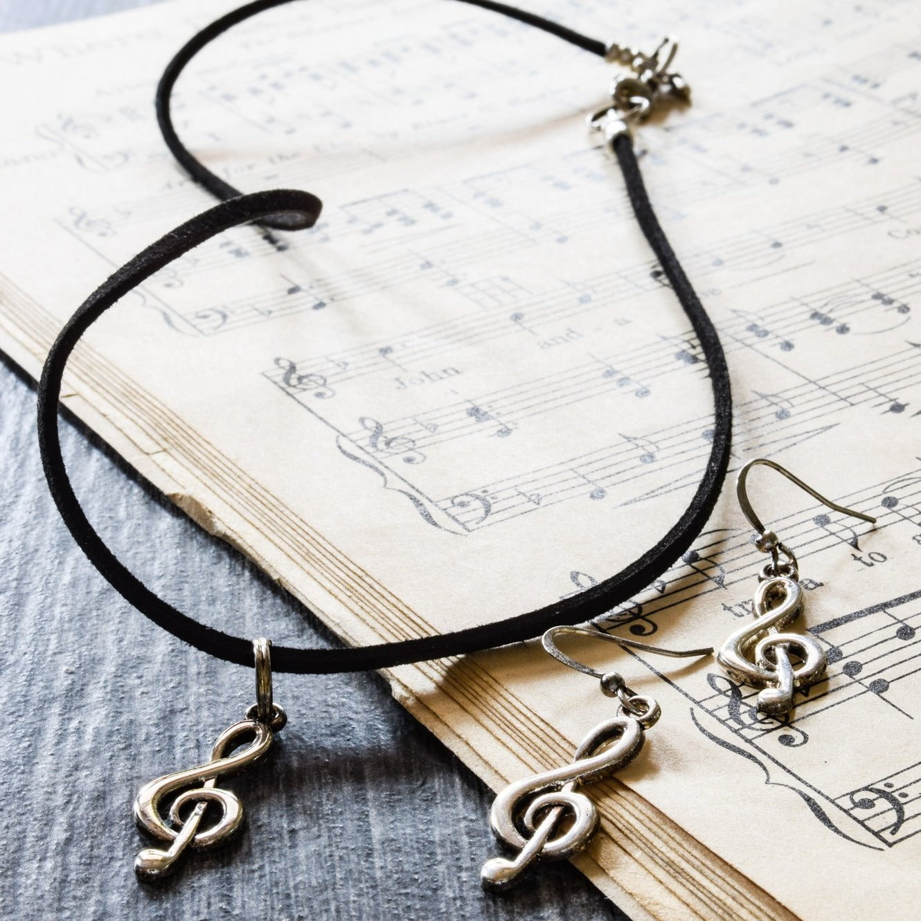 Little Treats, Faux Leather Cord Necklace with a Silver Treble Clef Pendant