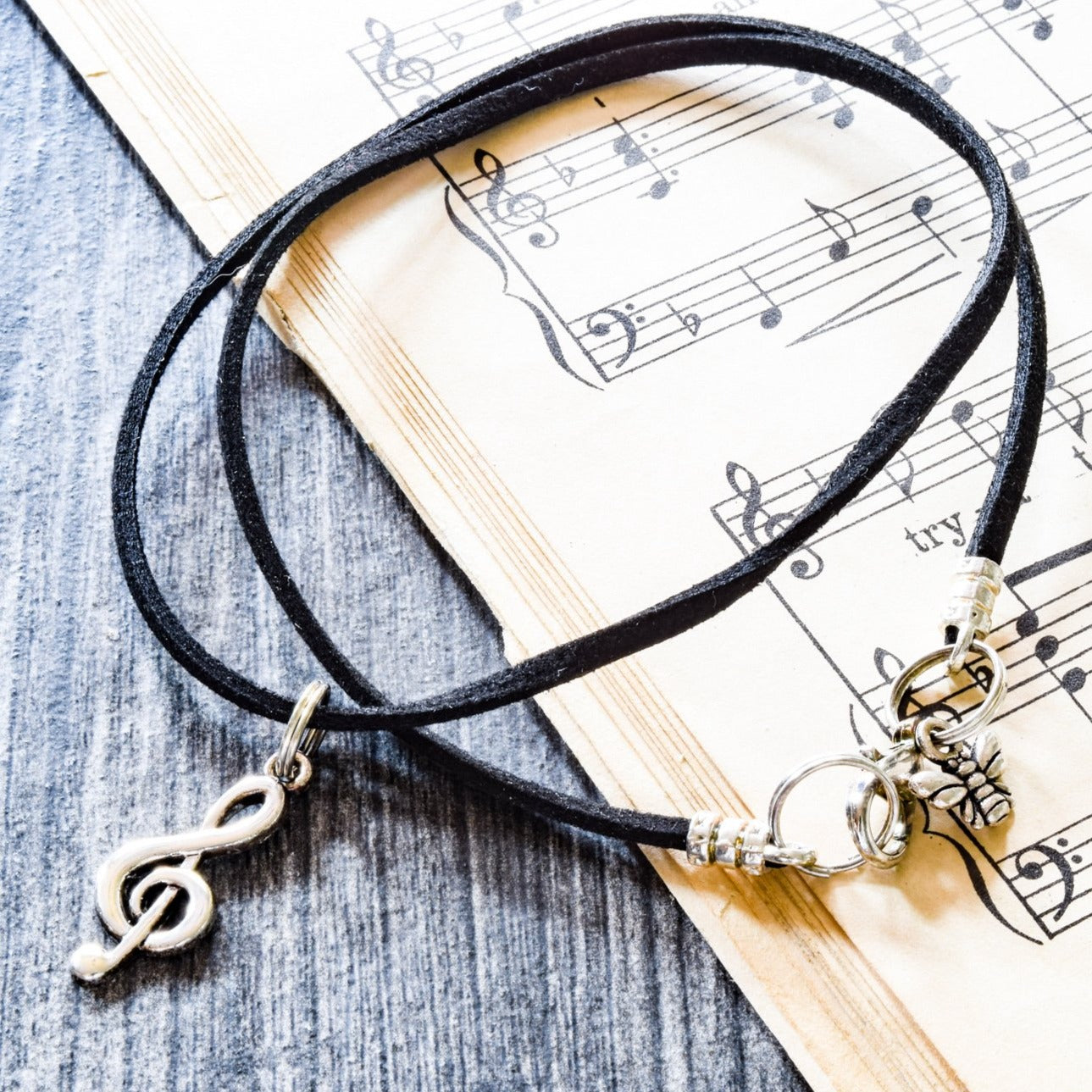 Little Treats, Faux Leather Cord Necklace with a Silver Treble Clef Pendant