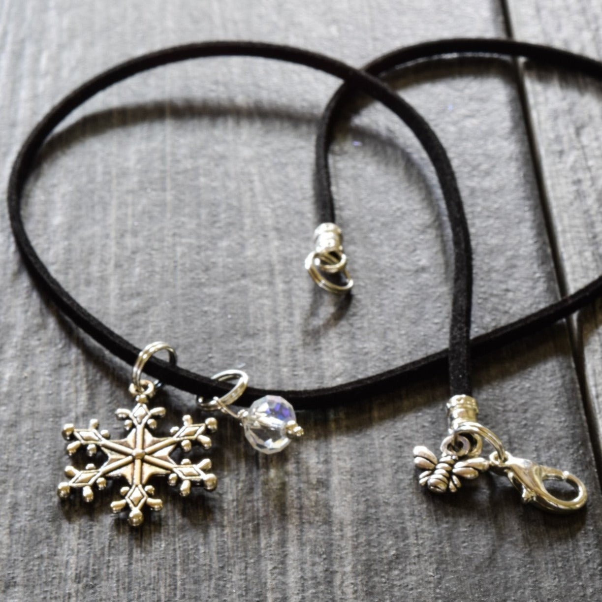 Holidays, Let It Snow - Faux Leather Necklace with a Silver Snowflake, Crystal, and Bumblebee