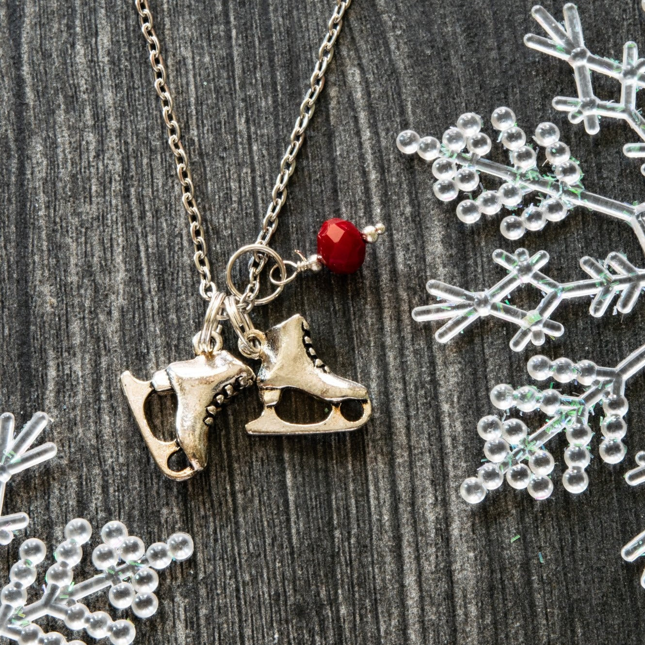 Holidays, Let it snow - Stainless Steel Necklace with Ice Skates, Faceted Red Glass Bead, and Bumblebee