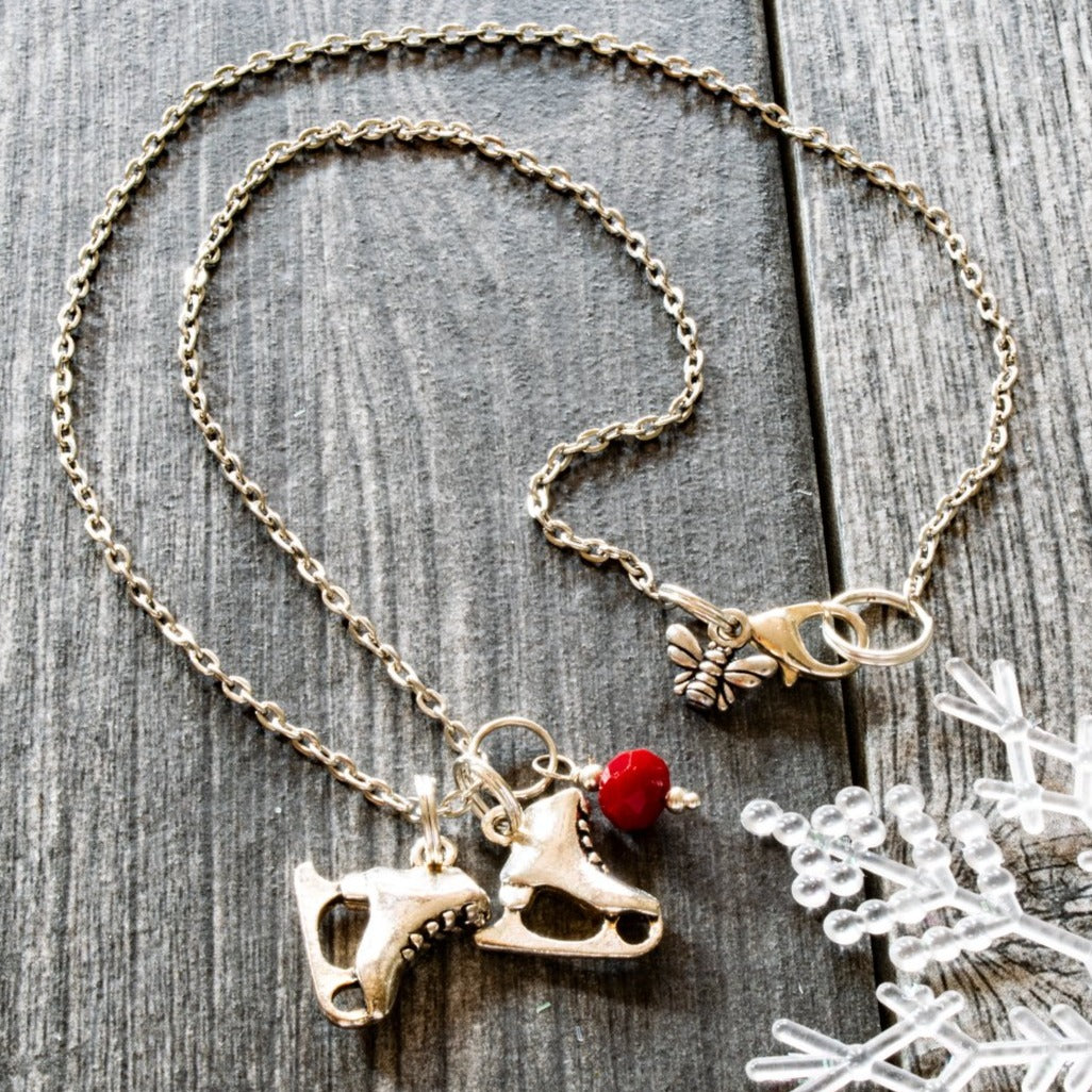 Holidays, Let it snow - Stainless Steel Necklace with Ice Skates, Faceted Red Glass Bead, and Bumblebee