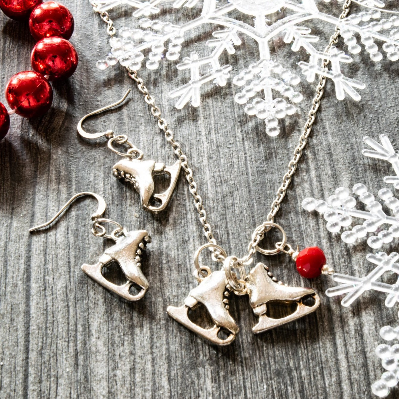 Holidays, Let it snow - Stainless Steel Necklace with Ice Skates, Faceted Red Glass Bead, and Bumblebee