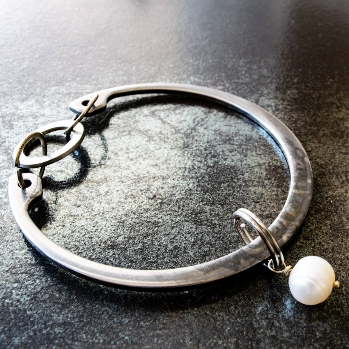 Impressions, Industrial Steel Bracelet with a White Pearl Bangle