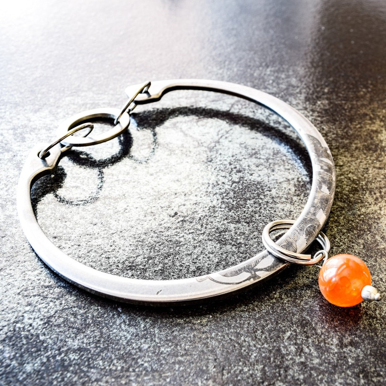 Impressions, Industrial Steel Bracelet with a Cinnamon Agate Bangle