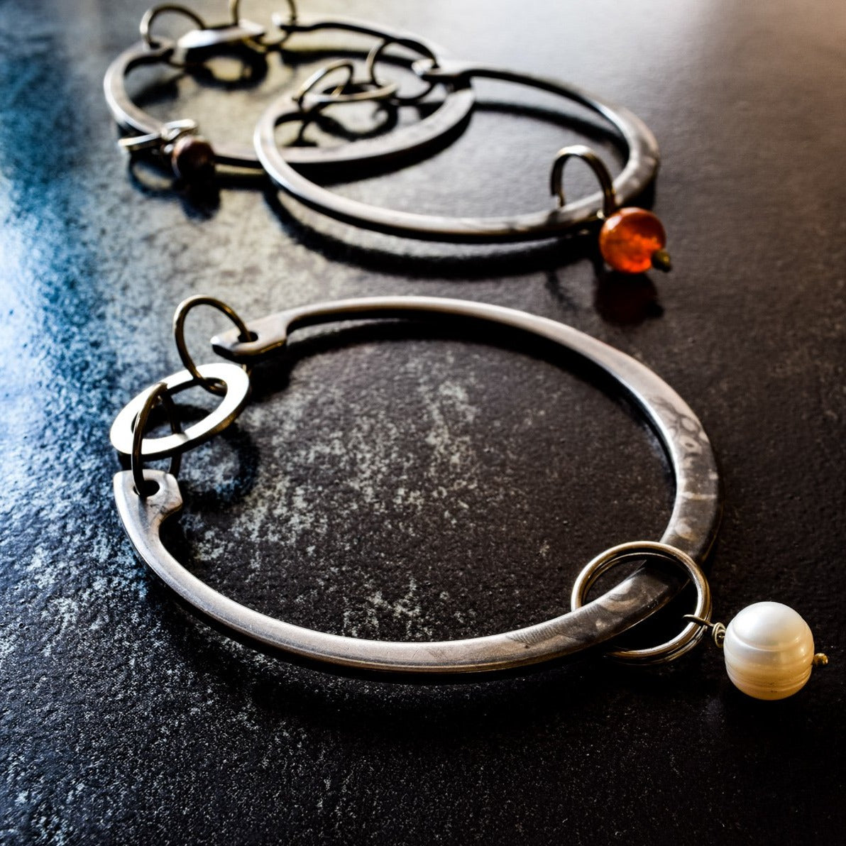 Impressions, Industrial Steel Bracelet with a White Pearl Bangle