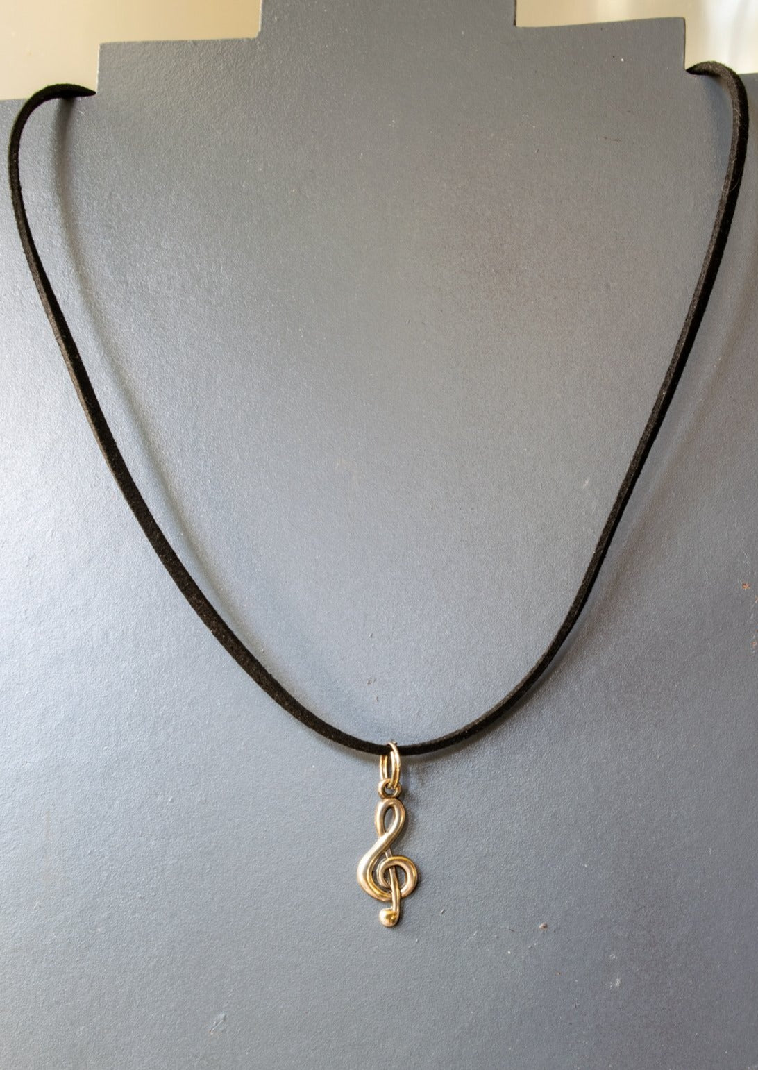 Little Treats, Faux Leather Cord Necklace with a Silver Treble Clef Pendant