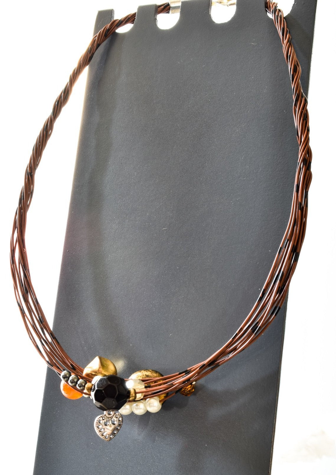 Strands, Brown with Black Wire Necklace with Glass, Stone, and Metallic Beads, and a Heart Charm