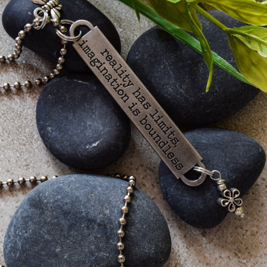 Words to Inspire, Ball Chain Necklace with Engraved Metal Tag "Reality has limits"