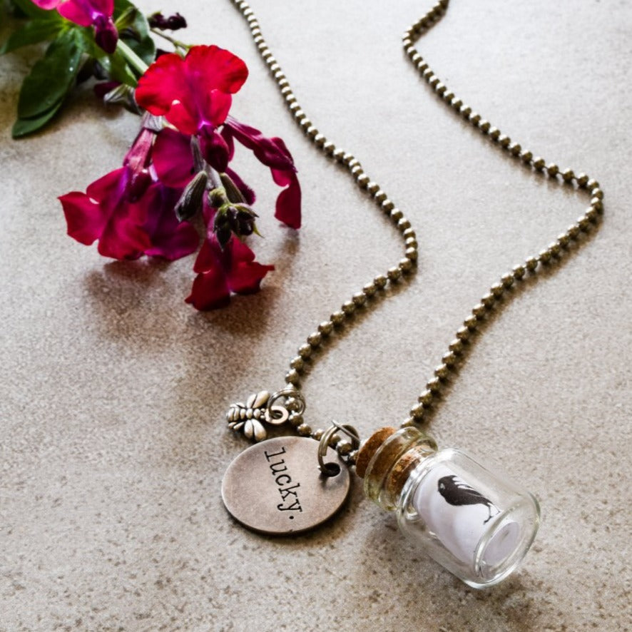 Little Messages, Ball Chain Necklace with ''Black Bird'' Small Glass Bottle Pendent and "Lucky" Tag Charm