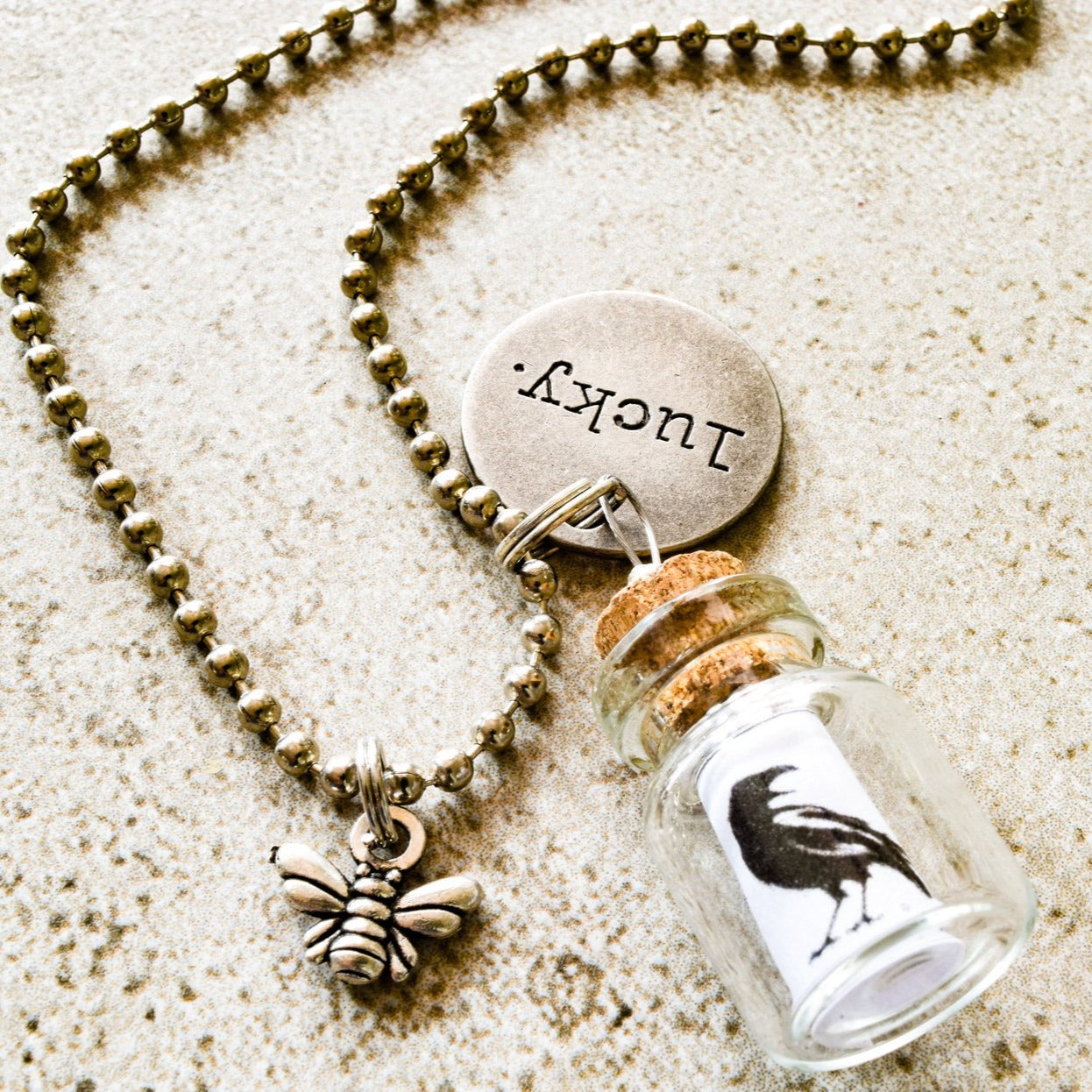 Little Messages, Ball Chain Necklace with ''Black Bird'' Small Glass Bottle Pendent and "Lucky" Tag Charm