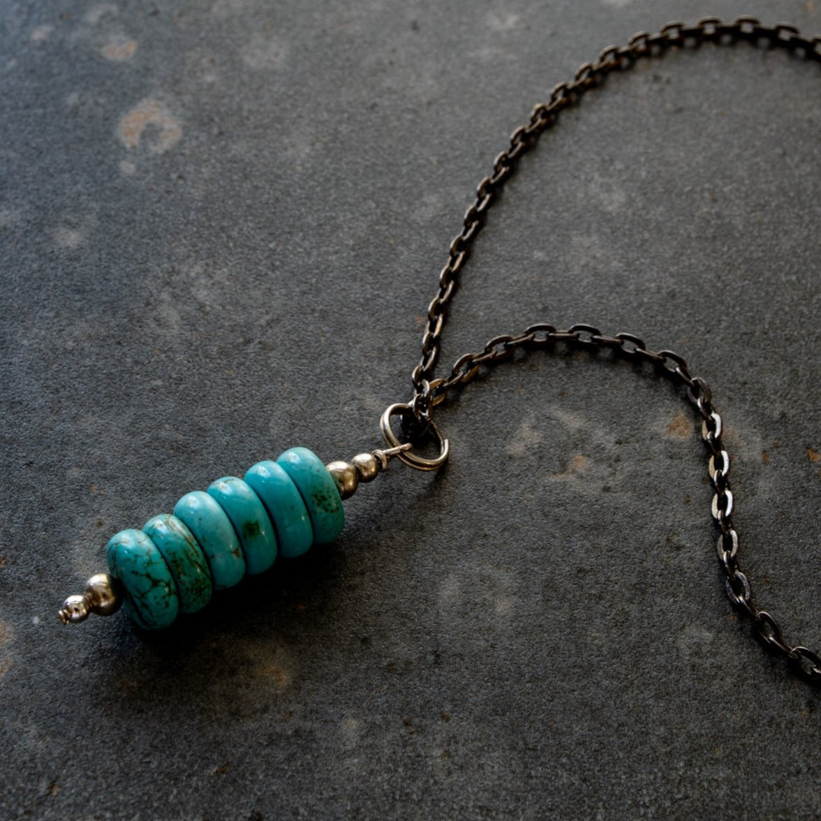 Expressions in Turquoise, 19 inch Stacked Turquoise Pendent on a Gunmetal Necklace