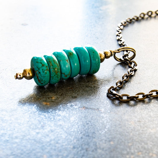 Expressions in Turquoise, 19 inch Stacked Turquoise Pendent on a Gunmetal Necklace