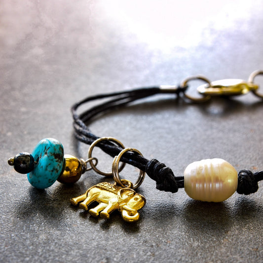 Istanbul, Black Strands Bracelet with a Gold Elephant, Turquoise, and a Fresh Water Pearl