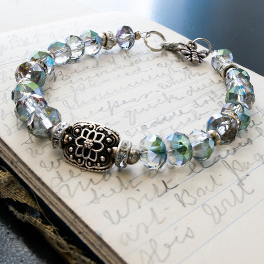 Expressions in Blue, Bracelet with Electro-Plated Crystals, Silver beads, and an Antiqued Silver Flower